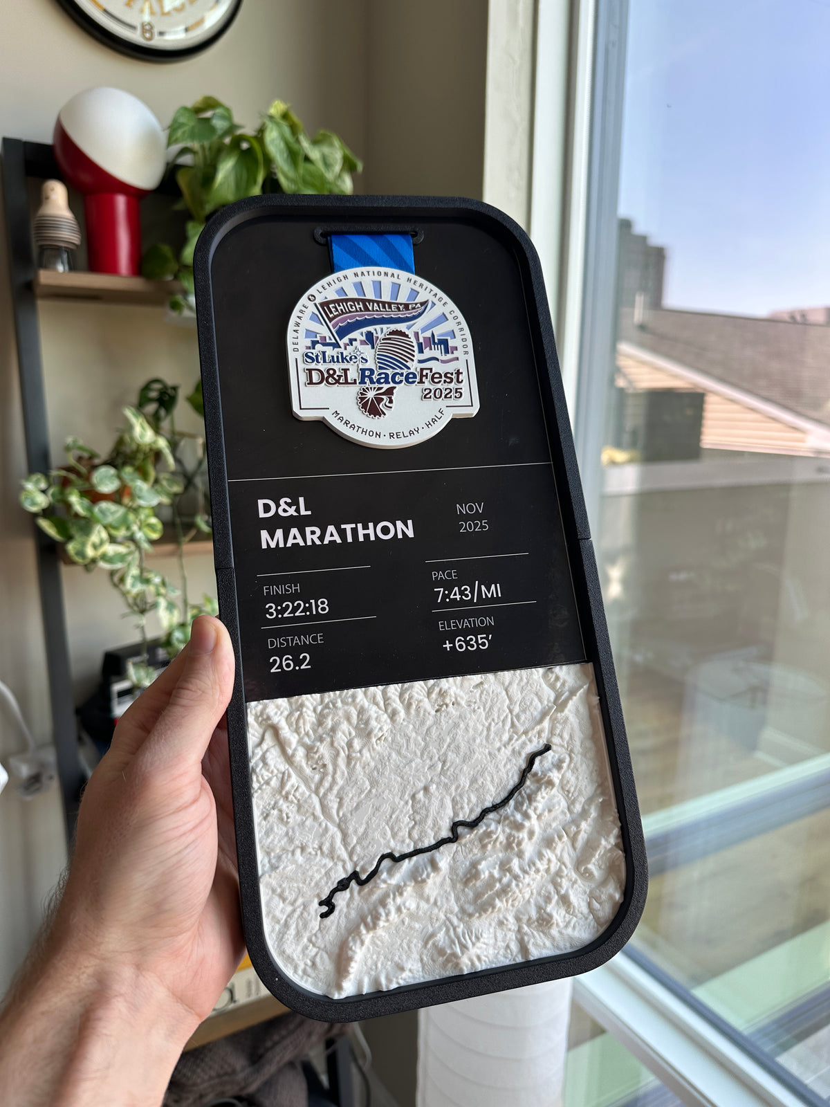 A 3D printed race course relief held in one hand